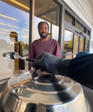 Emp-Man (anonymous) Serving Love and Gourmet Goodness to the Homeless